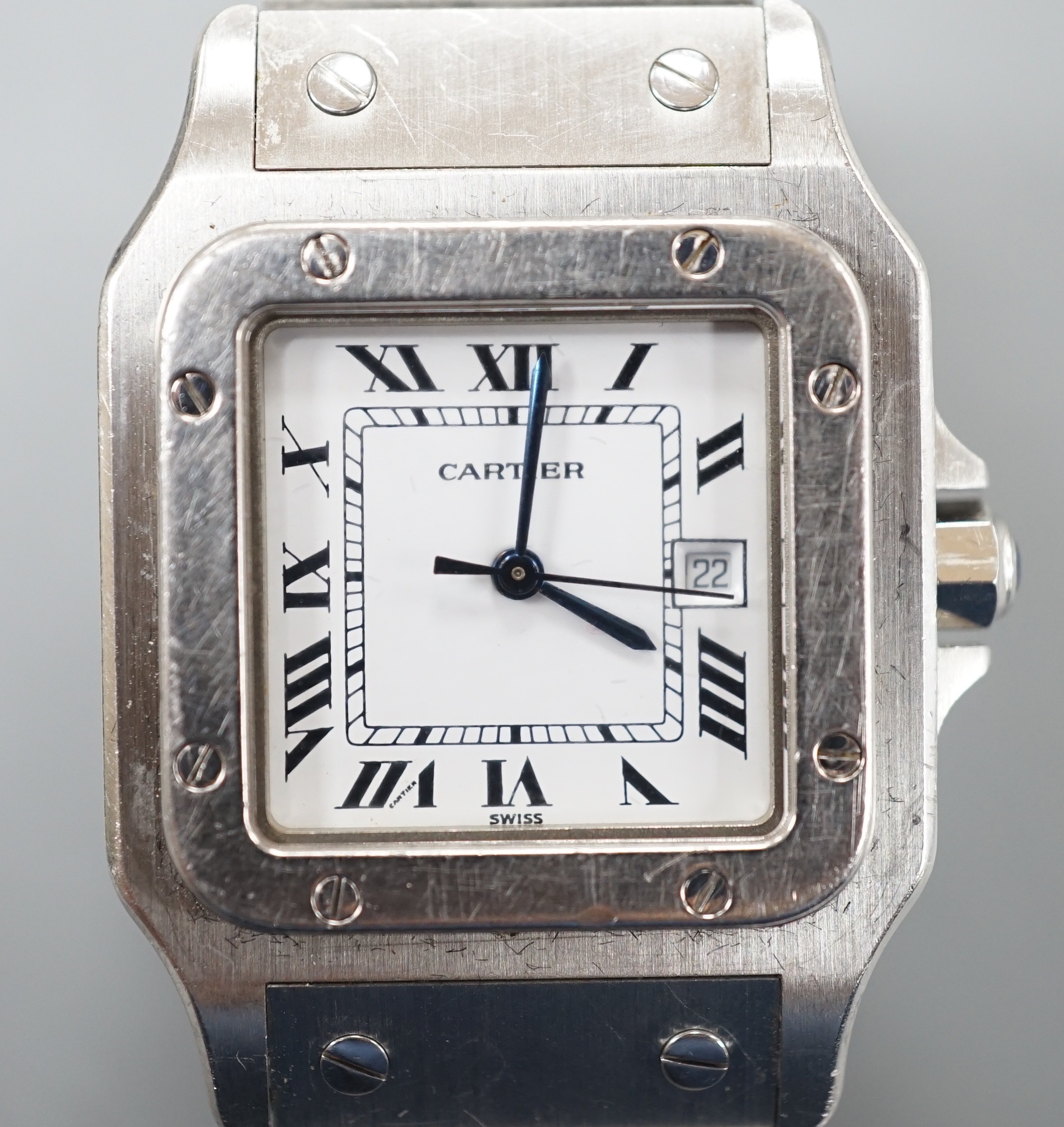 A gentleman's stainless steel Santos de Cartier automatic wrist watch, with Roman dial and date aperture, case diameter 29mm, no box or papers.